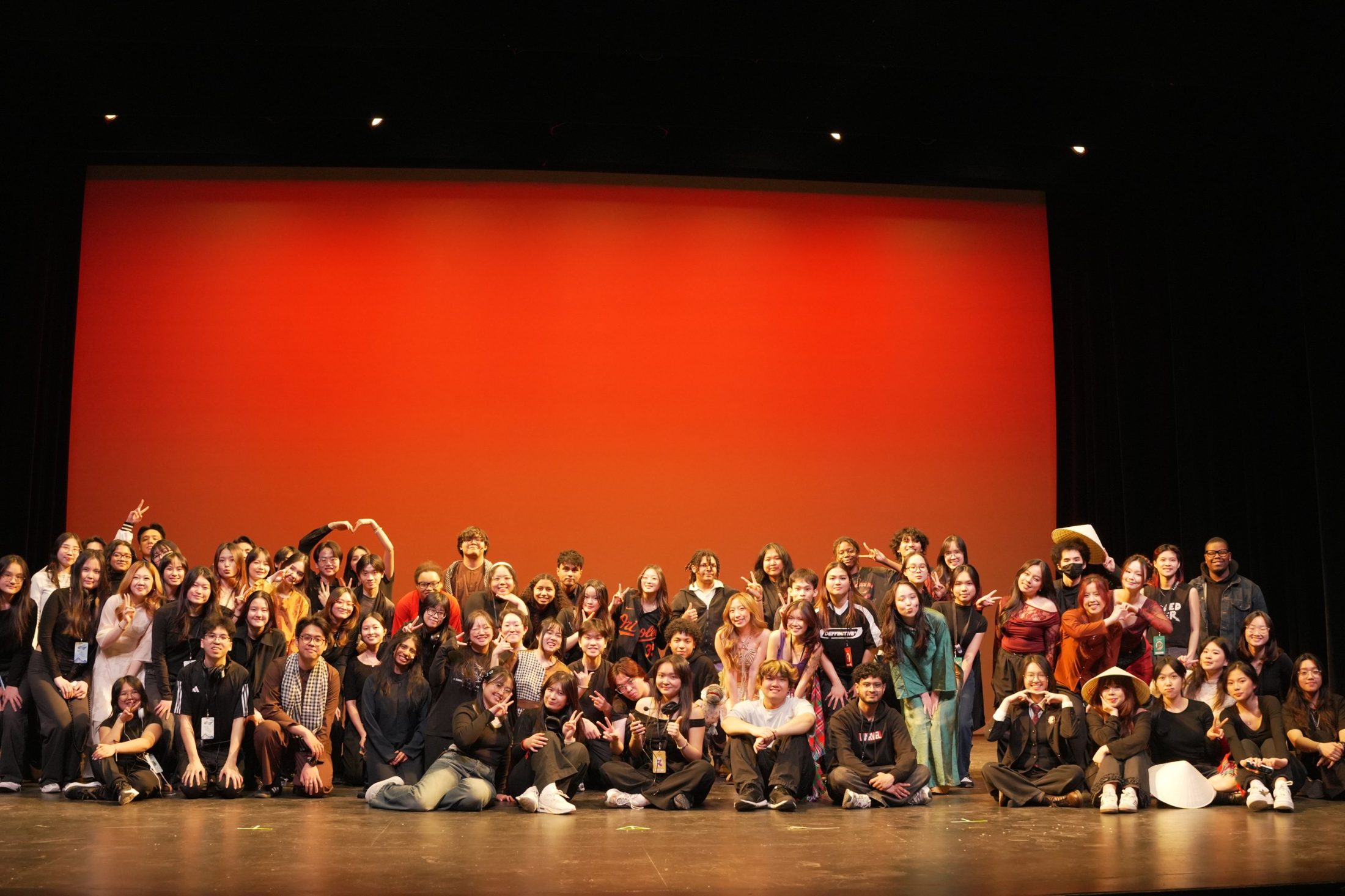 Cast and crew of Drexel VSA Culture Show 2026 on stage in front of a red backdrop